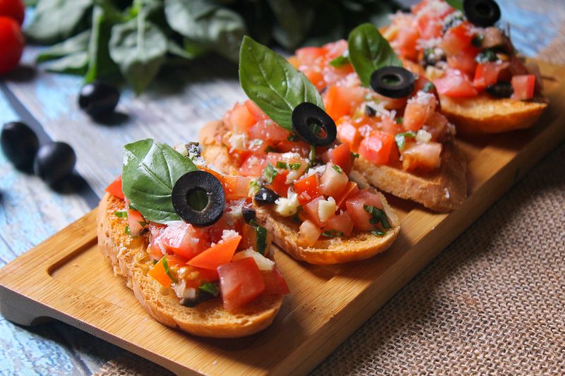 Bruschetta al Pomodoro with tomatoes and basil on toasted bread