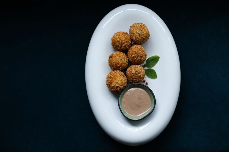 Fried Arancini risotto balls with marinara dipping sauce