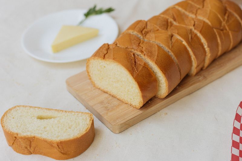 Warm Italian bread with herb butter and sea salt