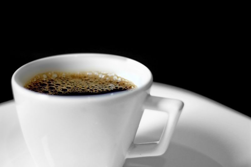 Rich Italian espresso coffee served in ceramic cup